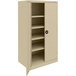 A tan Tennsco metal storage cabinet with shelves.