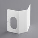 A white rectangular object with a hole in it.