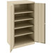 A tan metal Tennsco storage cabinet with open doors and shelves.