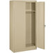 A tan metal Tennsco wardrobe cabinet with solid doors open.