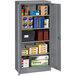 A dark gray Tennsco standard storage cabinet with solid doors.