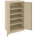 A tan Tennsco metal storage cabinet with open doors and shelves.