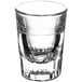 A clear Libbey fluted shot glass with a thin line near the bottom.