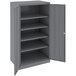 A dark gray metal Tennsco storage cabinet with solid doors.