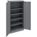 A dark gray metal Tennsco storage cabinet with solid doors.