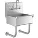 A stainless steel Regency utility hand sink with a wall mounted faucet.