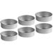 A group of round silver Choice cake pans.