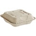 A white World Centric compostable fiber clamshell container with a lid.