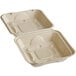 A white World Centric compostable fiber clamshell container with two lids.