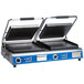 A Globe blue and silver commercial Panini grill with black rectangular metal plates.