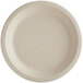 A World Centric 7" round compostable fiber plate with a beige rim.