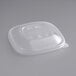 A clear plastic World Centric compostable PLA lid on a clear plastic container.
