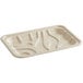 A World Centric compostable fiber meat tray on a white surface.