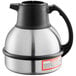 A Bunn Zojirushi stainless steel coffee carafe with a black top.
