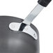 A close-up of a Thunder Group black and silver anodized non-stick aluminum sauce pan and handle.