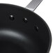 A black Thunder Group anodized non-stick sauce pan with a handle.