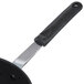 A black and silver spatula with a handle.
