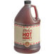 A white jug of Mike's Hot Honey with a red and white label.