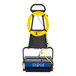 A blue and yellow Powr-Flite Multiwash XL floor scrubber with a yellow cable.