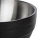 A black Vollrath beehive serving bowl with a stainless steel rim.
