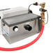A Thermaco Big Dipper supplemental water system for grease traps with a hose attached.