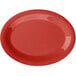 A red oval platter with a diamond design on a white background.