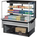 A Turbo Air drop-in refrigerated display case with drinks and cans inside.