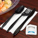 Choice Medium Weight Black Wrapped Plastic Cutlery Set with Napkin and Salt and Pepper Packets - 50/Pack Main Thumbnail 1