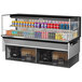 A Turbo Air black drop-in refrigerated display case with drinks inside.
