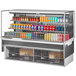 A Turbo Air drop-in refrigerated display case with shelves of drinks including soda cans.