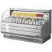 A Turbo Air stainless steel horizontal refrigerated display case with drinks inside.
