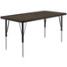 A Correll rectangular table with metal legs and a walnut brown top.