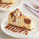A slice of cheesecake with Oringer butterscotch dessert topping on a plate.