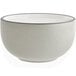 A white stoneware bowl with a black rim.