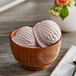 A wooden bowl of Oringer cherry hard serve ice cream.
