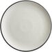 A grey matte stoneware plate with a coupe shape and black rim.