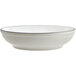 A white stoneware pasta bowl with a grey rim.
