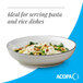 A gray matte stoneware pasta bowl filled with a pasta or rice dish.