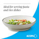 A gray matte stoneware pasta bowl filled with salad.