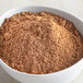 A bowl of brown McCormick Culinary Chinese Five Spice powder.