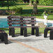 A group of brown MasonWays Dura-Benches with black legs next to a pool.