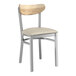 A Lancaster Table & Seating Boomerang Series chair with a light gray vinyl cushion and driftwood back.