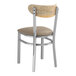A Lancaster Table & Seating Boomerang chair with a taupe cushion and driftwood back.