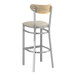 A Lancaster Table & Seating bar stool with a light gray vinyl seat and driftwood back.