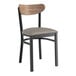 A Lancaster Table & Seating Boomerang Series black chair with a dark gray cushioned seat and wooden back.