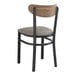 A Lancaster Table & Seating black wood chair with a dark gray cushioned seat.