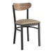 A Lancaster Table & Seating black chair with taupe cushion and wood back.