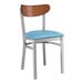 A Lancaster Table & Seating metal chair with a blue vinyl seat and antique walnut back.