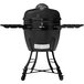 A black Louisiana Grills K24BLK Ceramic Kamado Charcoal Grill on a table with a lid.