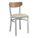 A Lancaster Table & Seating Boomerang Series wood chair with a light gray cushion.
